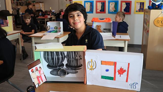 Grade 3 student with their culture box