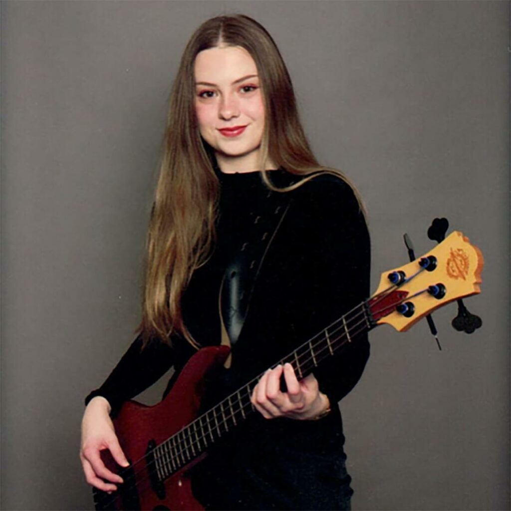 Photo of Paige with her guitar