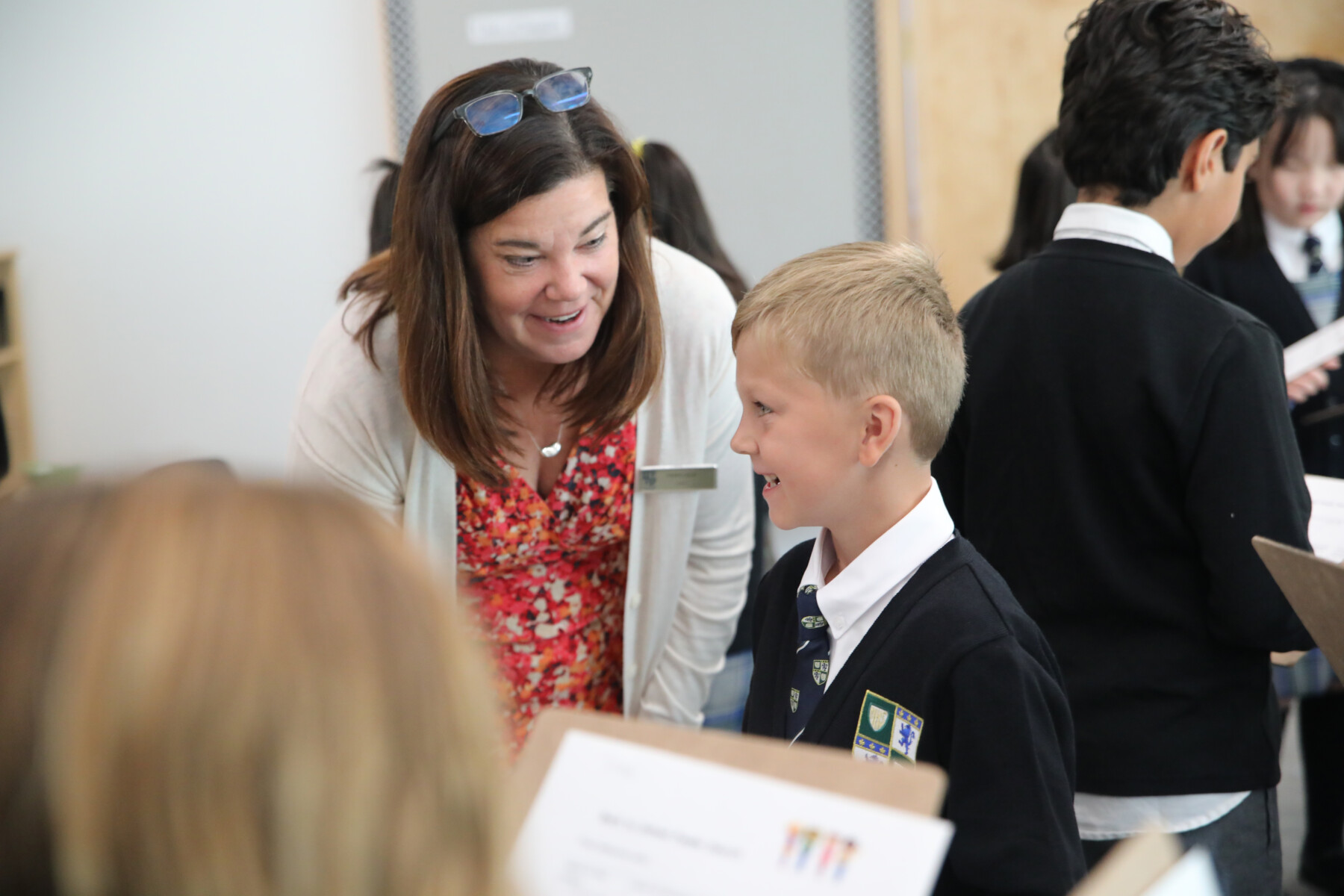 teacher leaning to student