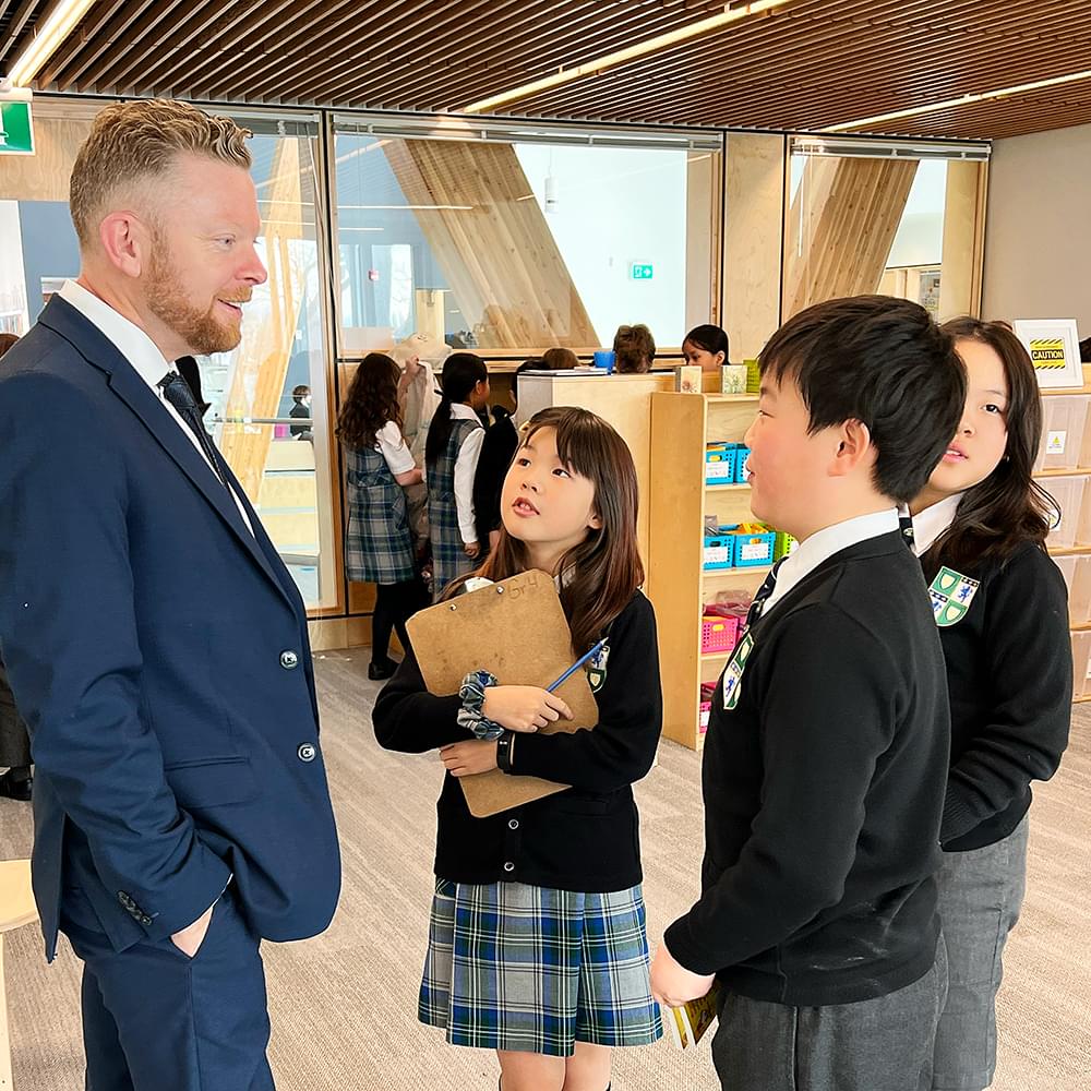 Chad speaking to Junior School students