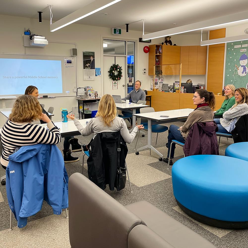 Middle School principal with parents at book club meeting