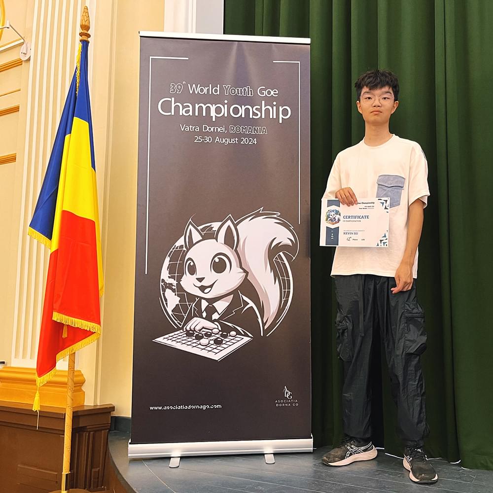 Student holding certificate at Go Championship