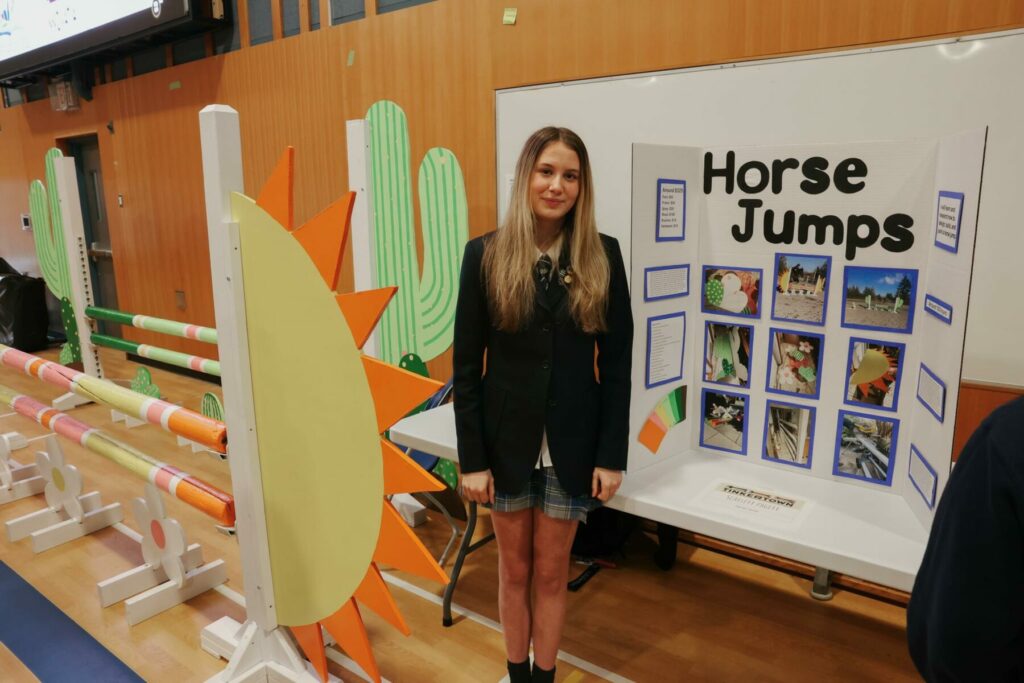 Student with project is featured