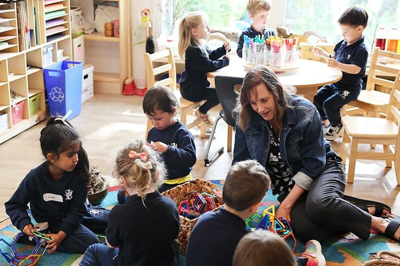 Teacher with JK students in classroom