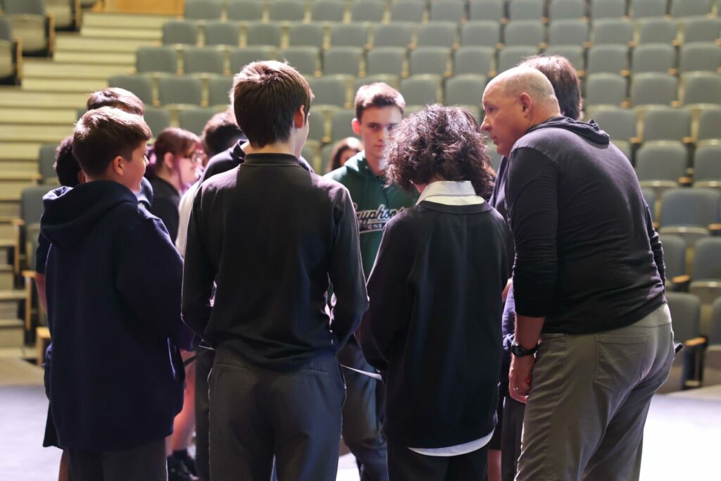 Jeff Gerber in conversation with GNS students, encouraging authentic connections and support.