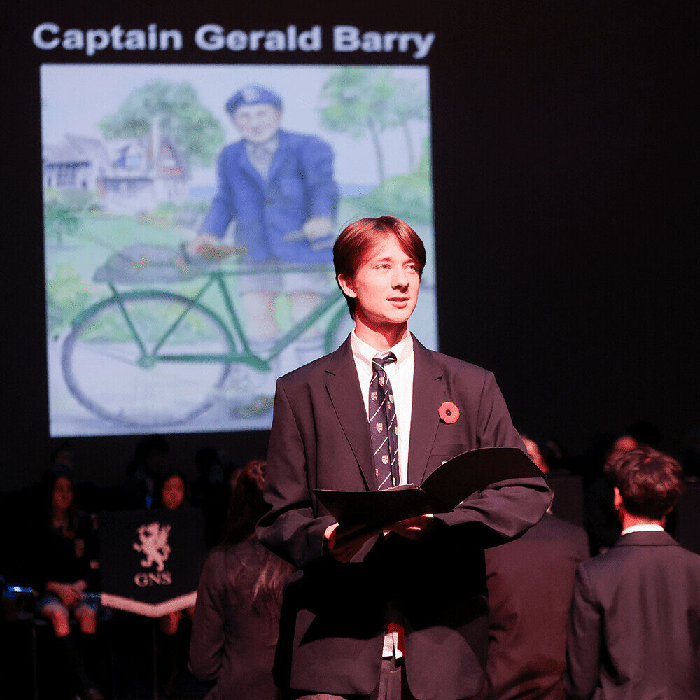 Student presenting at Remembrance Day assembly