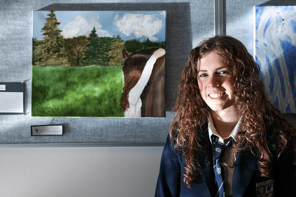 GNS student pictured with her artwork