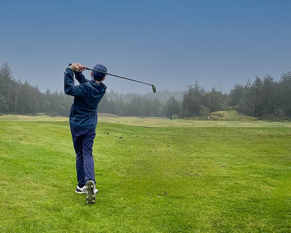 young golfer hitting a drive