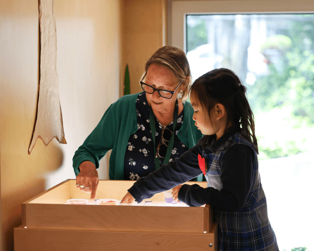 Ms. Teresa Johnson with a student