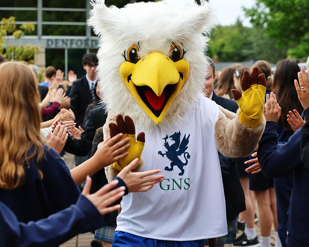 Gryphon mascot with students