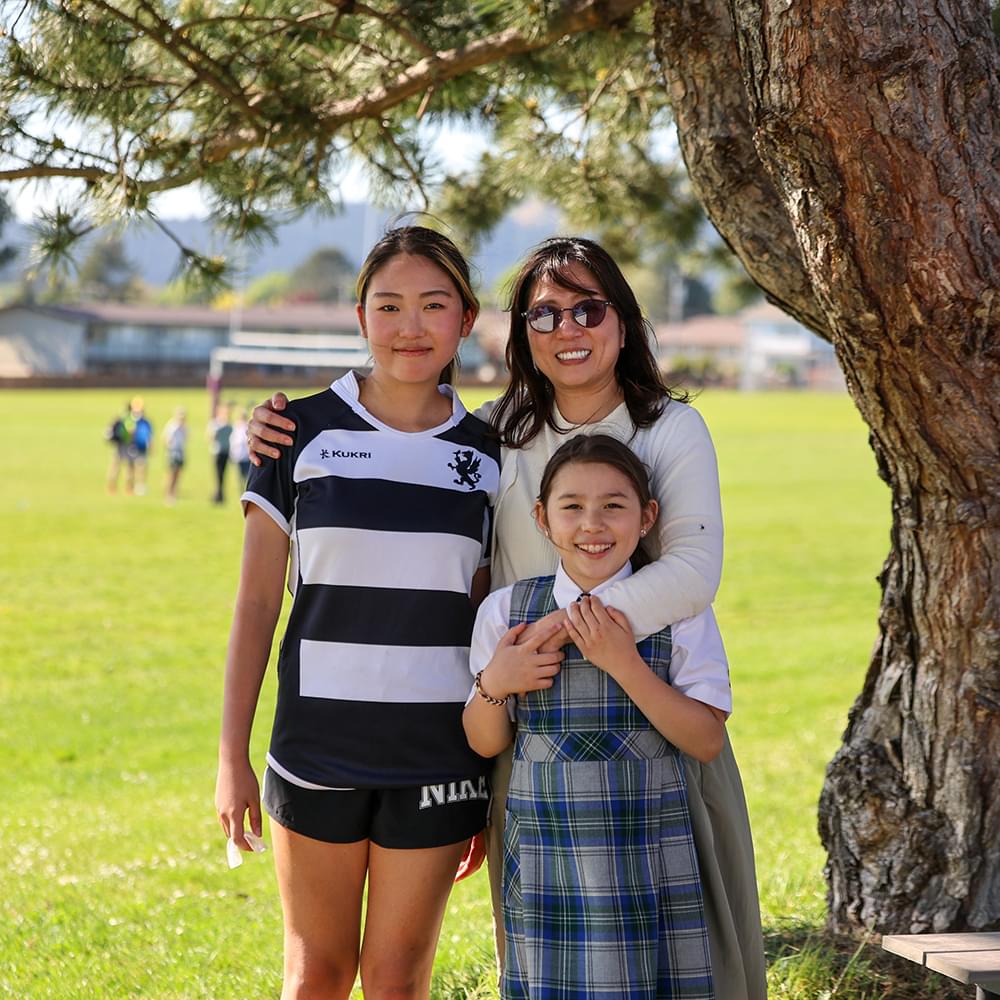 Family Boarding student with their host family at a rugby game