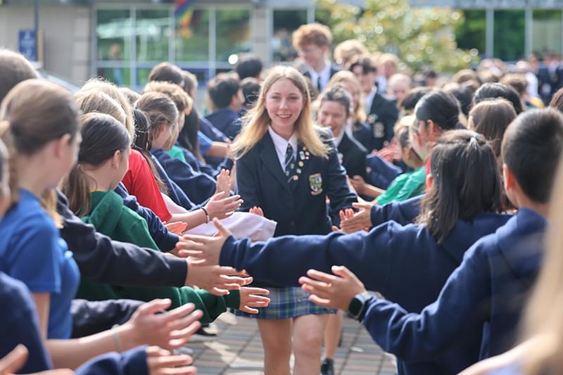 Senior School students getting high fives at Glenlyon Norfolk School